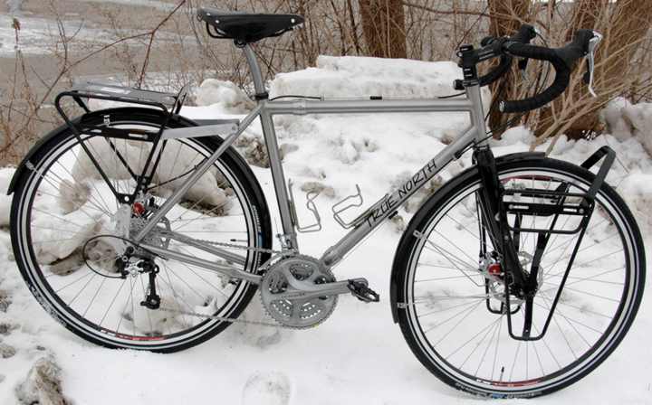 A Pair of True North Cycles Titanium touring bikes with S and S Couplings